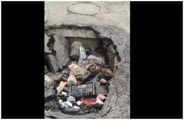 Ավան վարչական շրջանի Դուրյան 33 հասցեի ճանապարհային փոսը գնալով վերածվում է աղբավայրի (տեսանյութ)